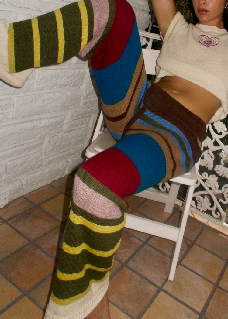 Model wearing multi-stripe pants