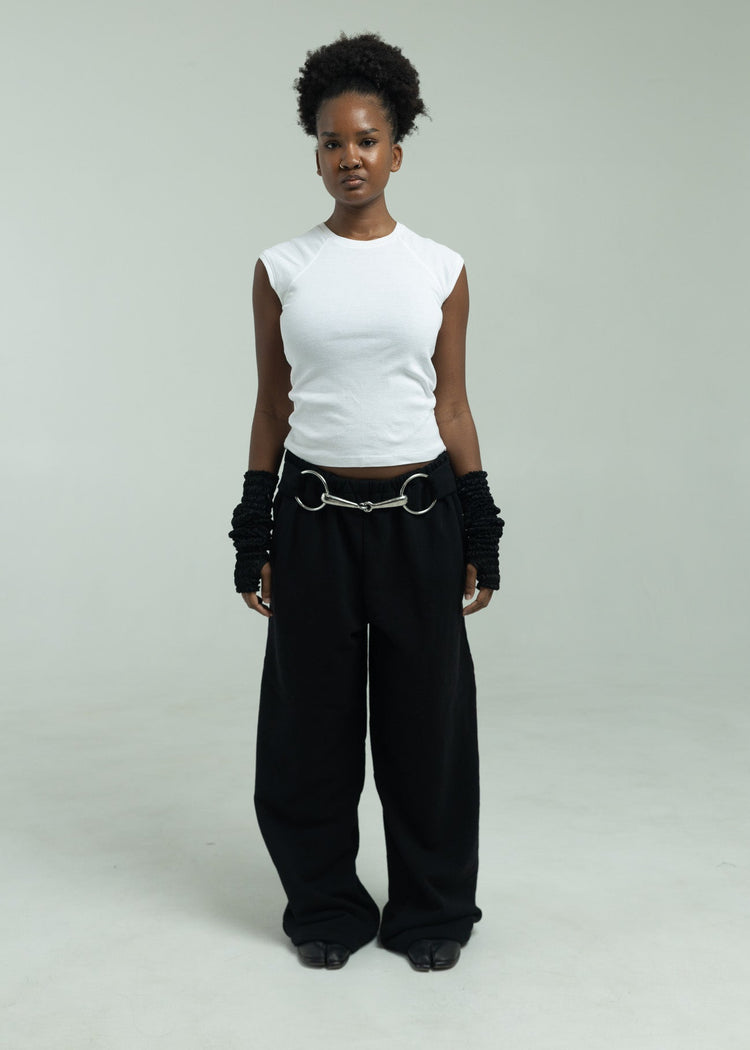 Model wearing black pants from the front