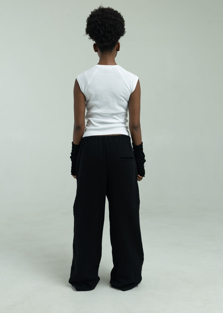 Model wearing black pants from the back
