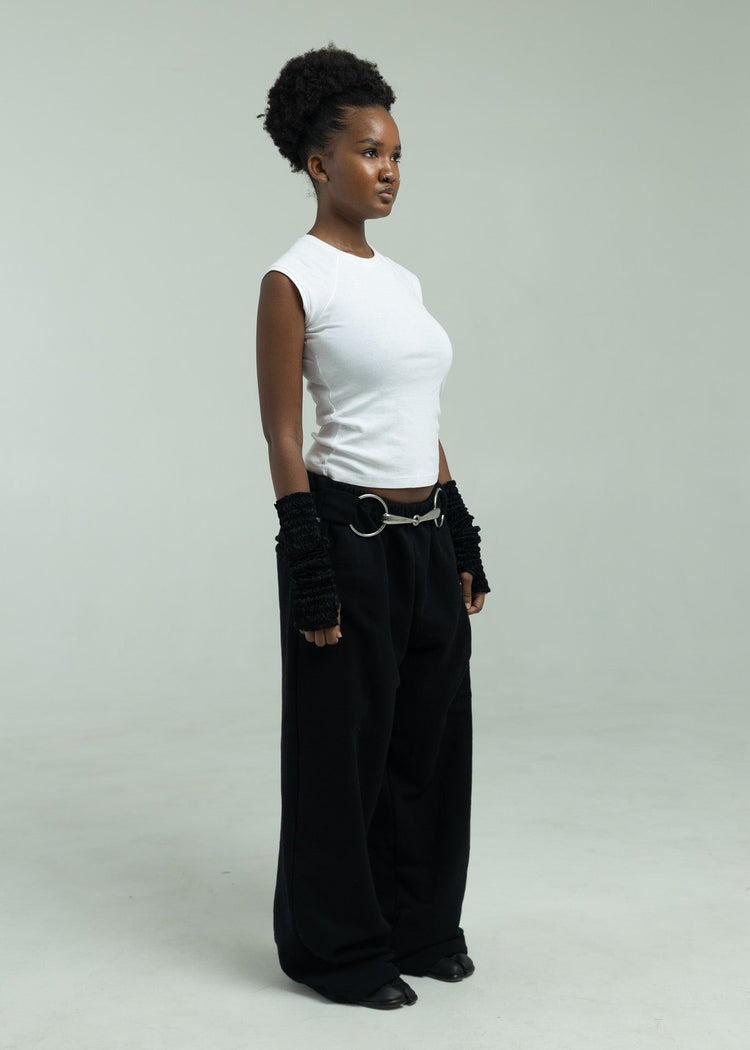 Model wearing black pants from an angle