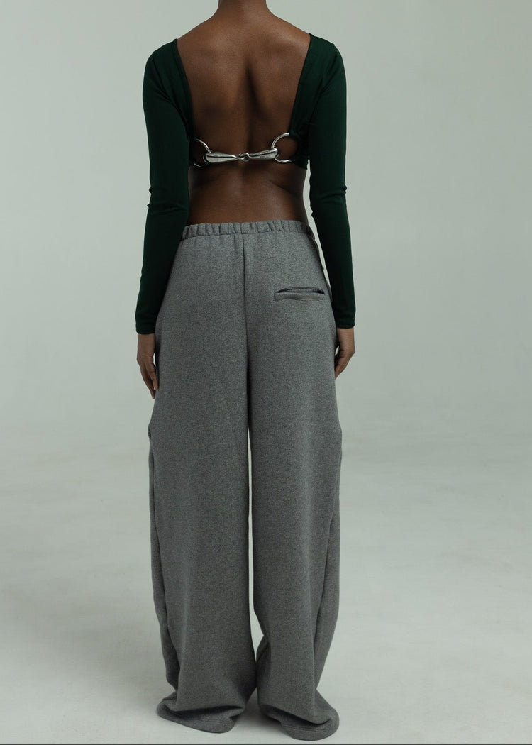 Model wearing charcoal pants from the back