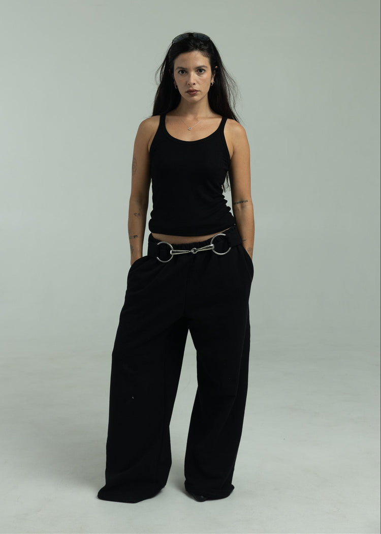 Model wearing black pants facing the camera