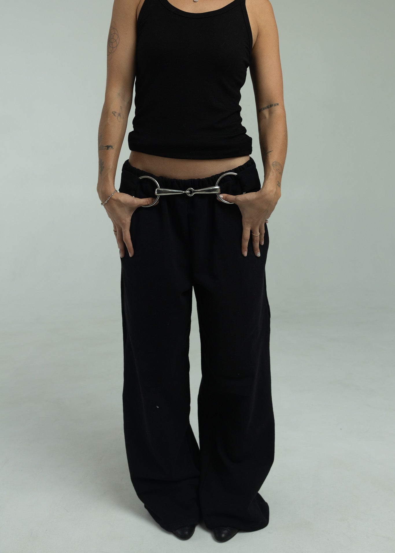 Model wearing black pants, main default photo