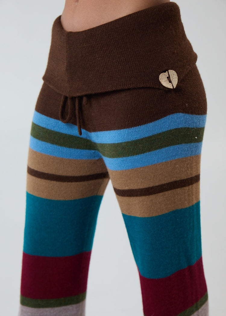 Model wearing multi-stripe pants