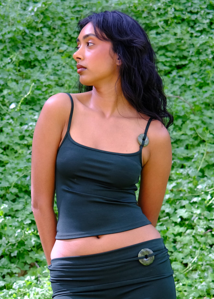 Model wearing scarab tank