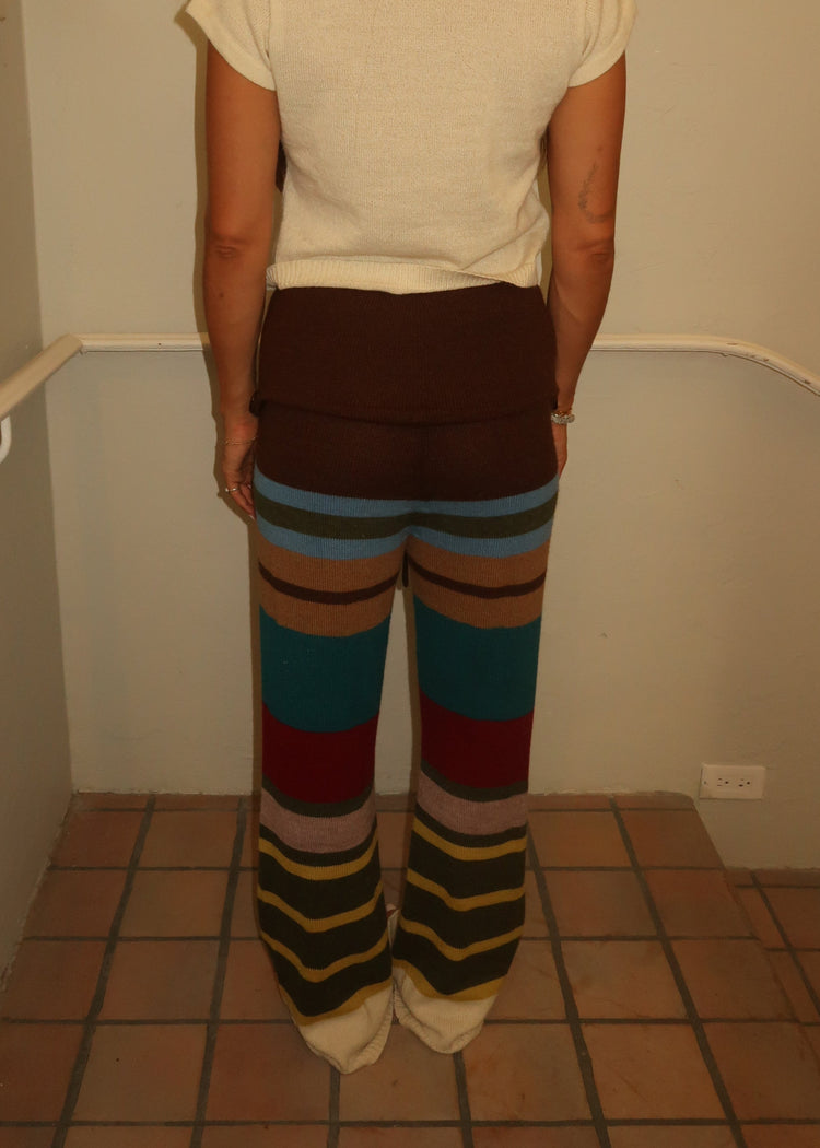 Model wearing multi-stripe pants