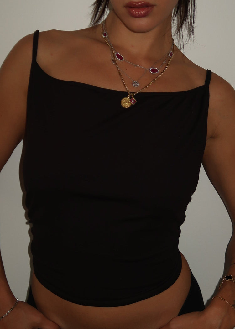 Model wearing Bit Top in black from the front