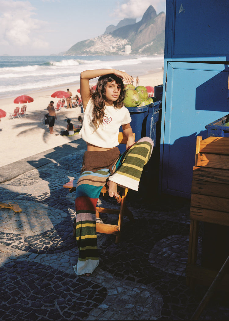 Model wearing multi-stripe pants