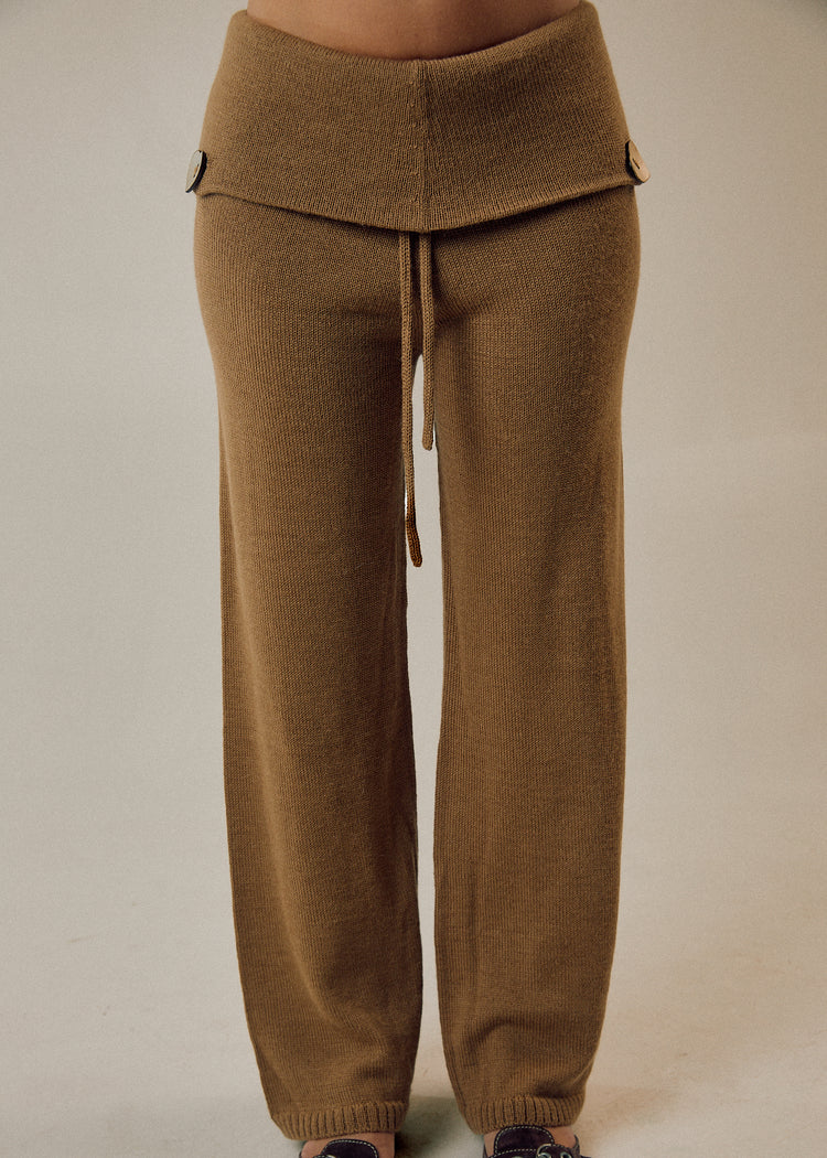 Model wearing camel pants