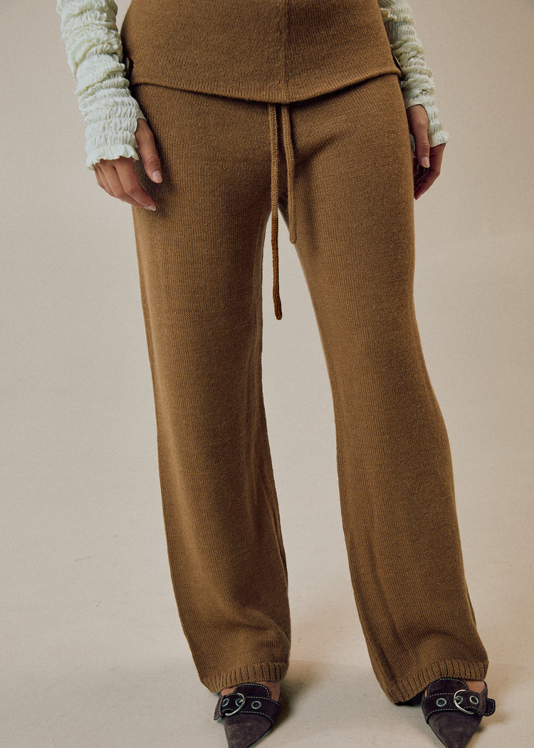 Model wearing camel pants
