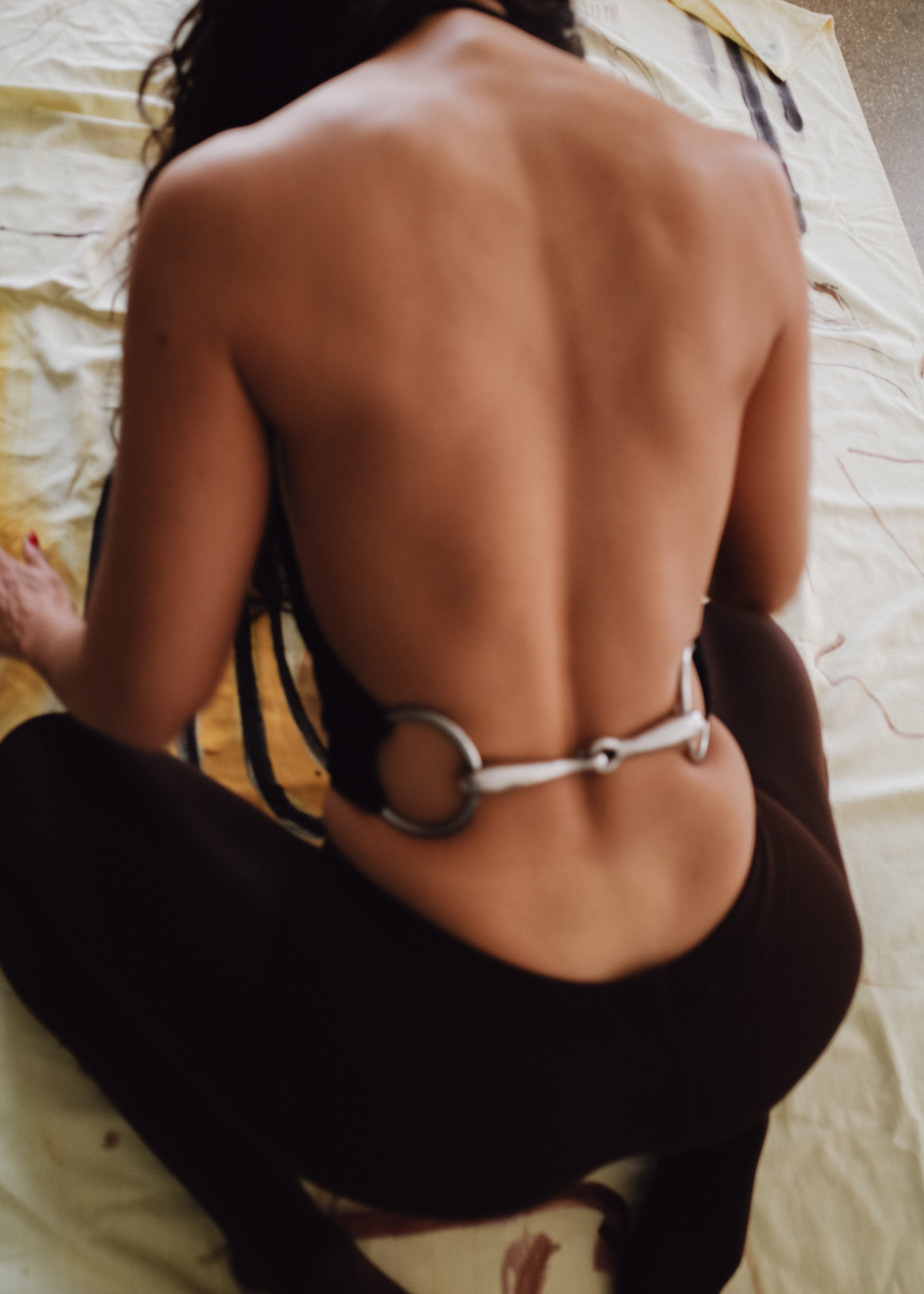 Model wearing Bit Top in black from the back, main default photo