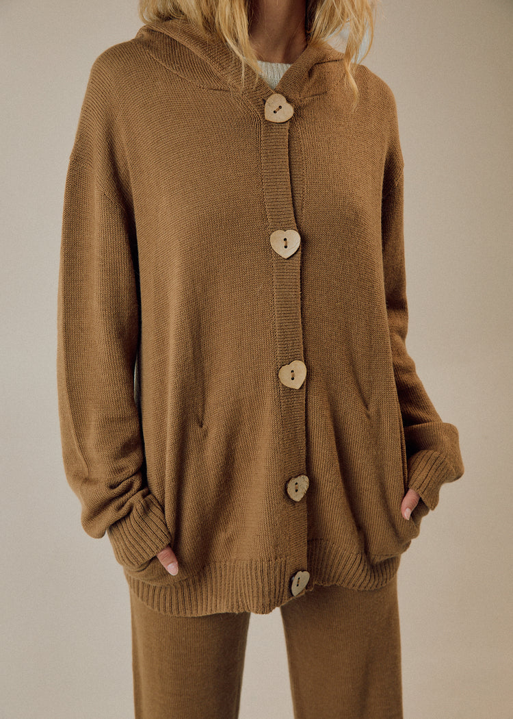 Model in camel cardigan